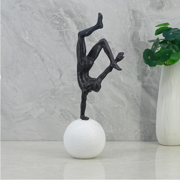 Willow Polyresin Man Balancing on Ball 30Cm in Black and White Color