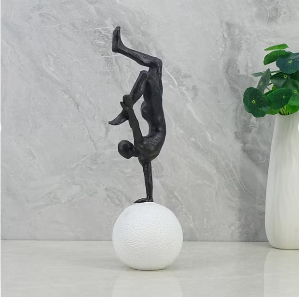 Willow Polyresin Man Balancing on Ball 30Cm in Black and White Color