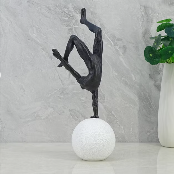 Willow Polyresin Man Balancing on Ball 30Cm in Black and White Color