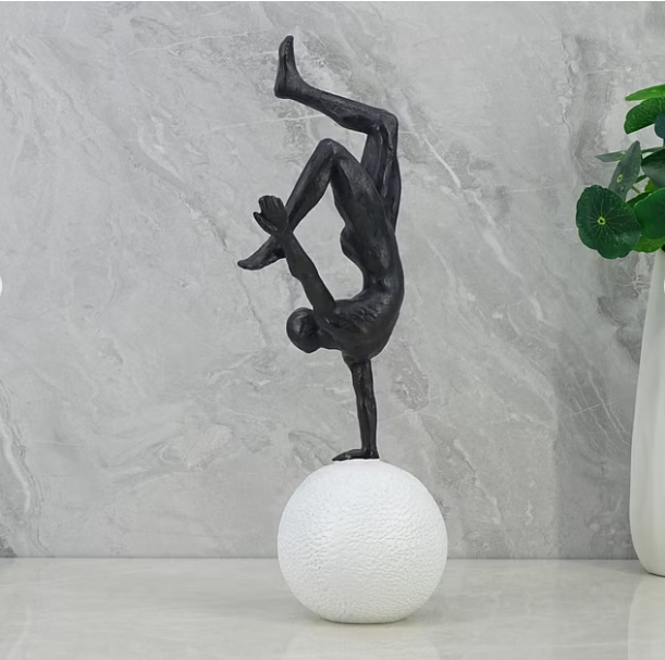 Willow Polyresin Man Balancing on Ball 30Cm in Black and White Color